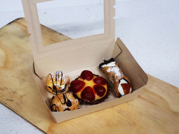 a takeaway dessert box at The Food Lab, Broome