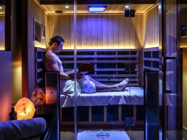 a man relaxing in a sauna at City Cave Noosa