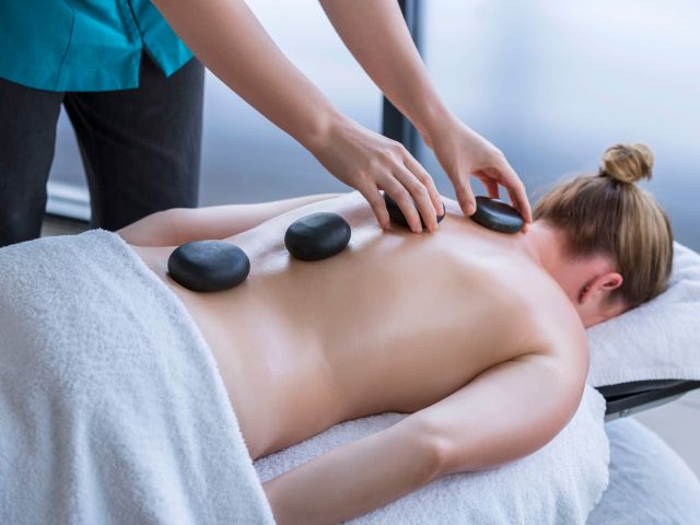 a soothing stone massage at One Spa, RACV Noosa Resort
