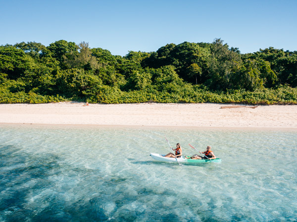a couple kayaking at Green Island, Great Barrier Reef