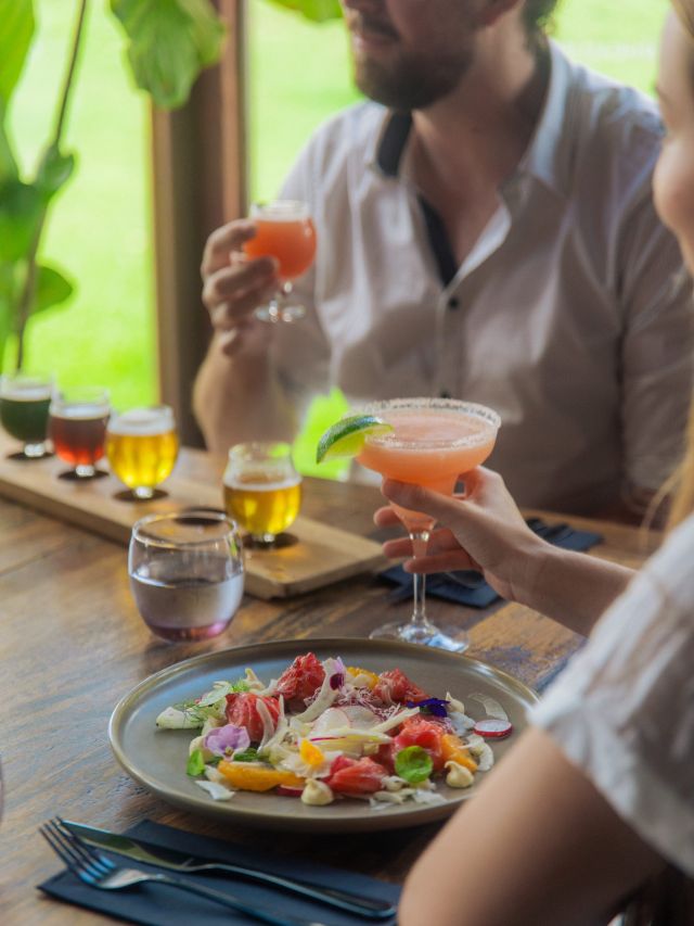 a couple dining and enjoying drinks at Copperhead Restaurant Brewery, Noosa