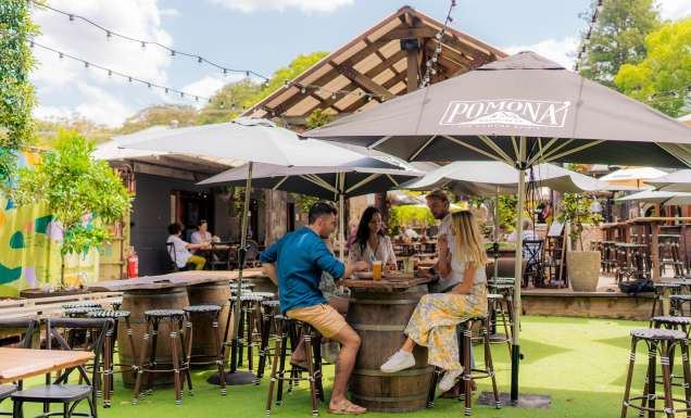 friends bonding over drinks at Pomona Distilling Co.