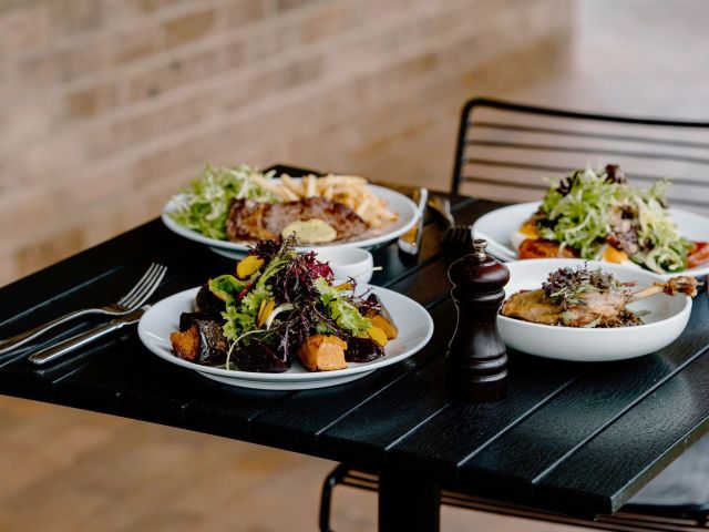 share plates on the table at Hearth by Moonacres, Bowral