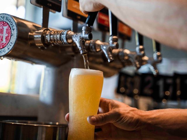 pouring tap beer into a glass at Heads of Noosa Brewing Co.