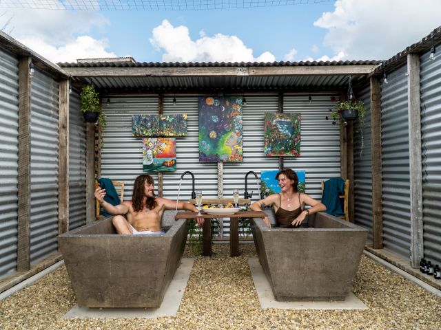 a couple relaxing at Kin Kin Spring Bathhouses, Noosa