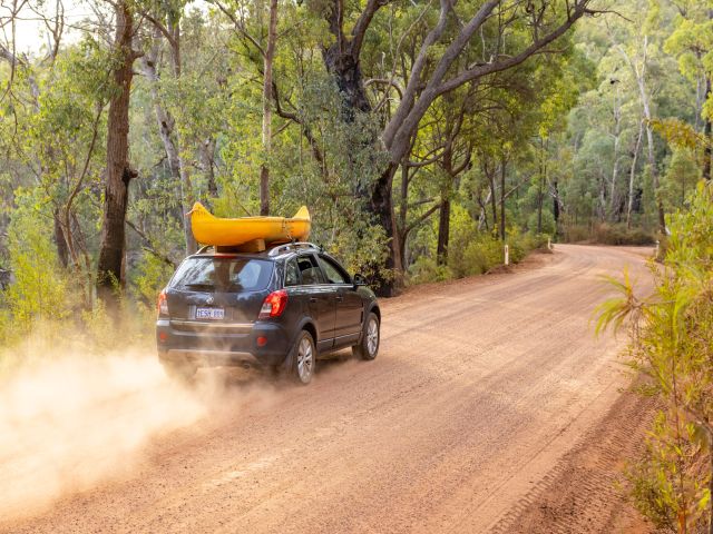 a car traversing a dusty road in Perth