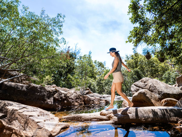 a woman taking the Boulder Creek Walk, Kakadu