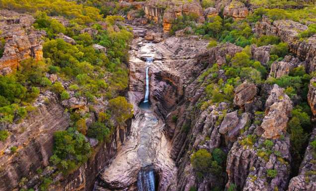 an aerial view of a waterfall in Kakadu