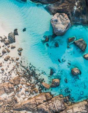 rocks dotting the clear blue waters of Boranup Beach