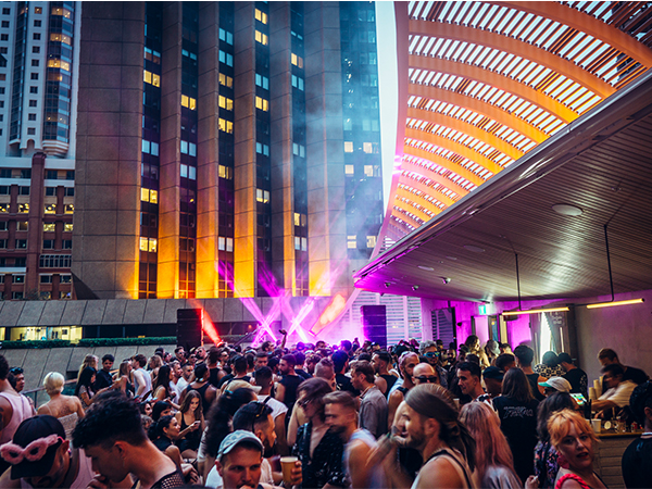 Neon lights and huge crowd of partygoers dancing the night away at Jacksons on George.