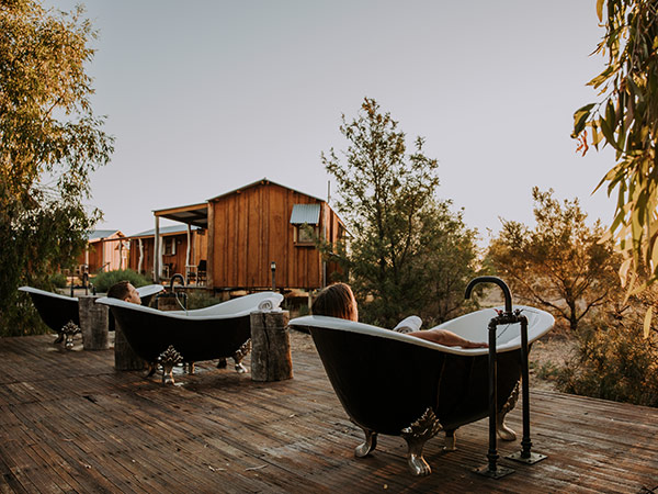 two people in the outdoor bath at saltbush retreat queensland