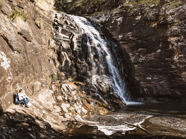 people sitting on the side of Sheoak Falls, Lorne