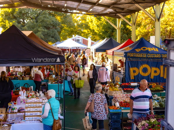 people perusing the stalls at Subiaco Markets