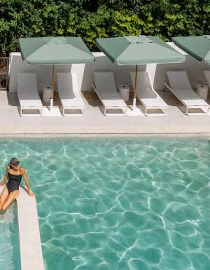 Woman in the pool at The Tamborine Hotel in the Gold Coast Hinterland