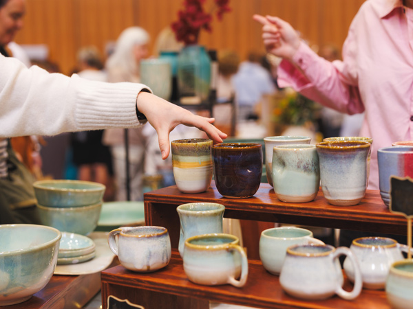 a hand picking up homewares at Perth Upmarket