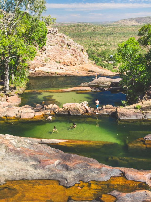 People swimming at Gunlom Falls in the Northern Territory