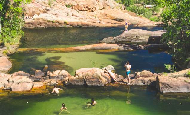People swimming at Gunlom Falls in the Northern Territory