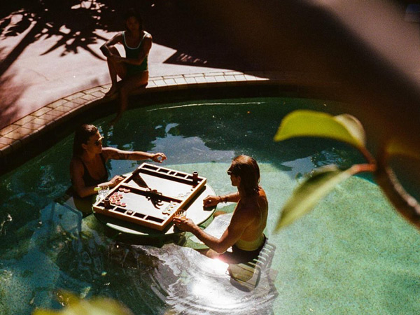a couple relaxing in the pool at The Sunseeker, Byron Bay