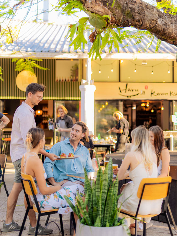 friends dining alfresco at Theo’s Social Club, Noosa