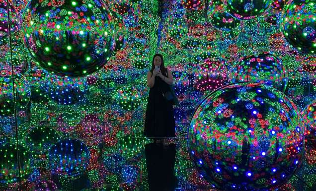 standing at the Infinity Mirror Room, Yayoi Kusama at the National Gallery of Victoria