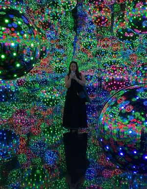 standing at the Infinity Mirror Room, Yayoi Kusama at the National Gallery of Victoria