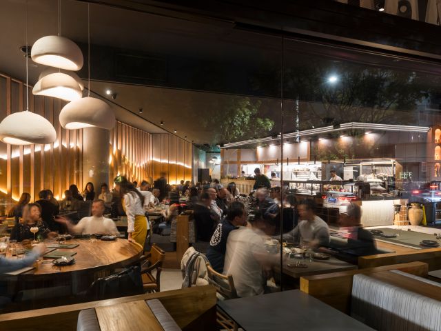 a dimly lit dining interior at Callao