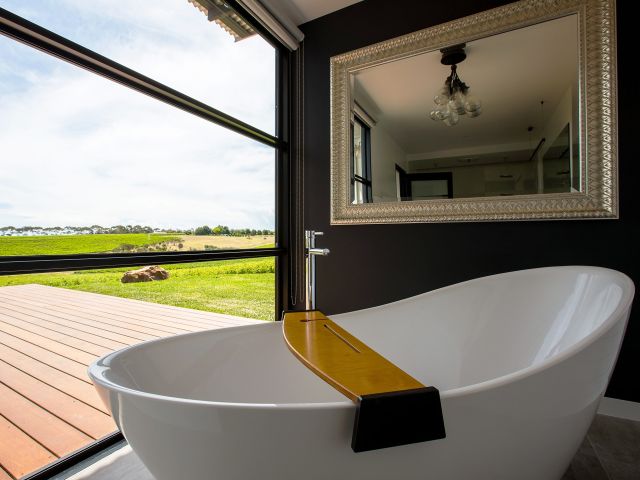 a bathtub overlooking scenic vineyard views at Hotel California Road at Inkwell Wines, McLaren Vale