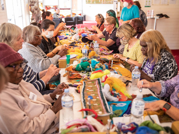people making a beanie at the Alice Springs Beanie Festival