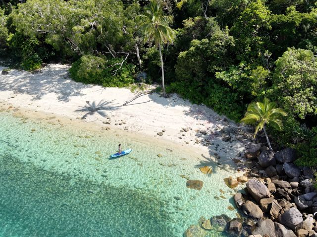 Dunk Island Coconut Bay aerial shot of paddleboard