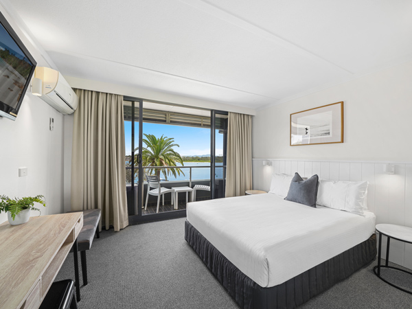 a bedroom with a window that opens up to river views, Port Macquarie