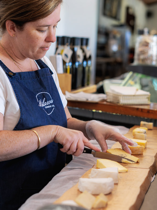 staff cutting cheese during the tasting at Milawa Cheese Company