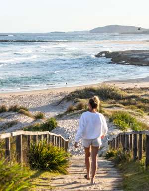 a woman walking to the shore, Pretty Beach, Shoalhaven