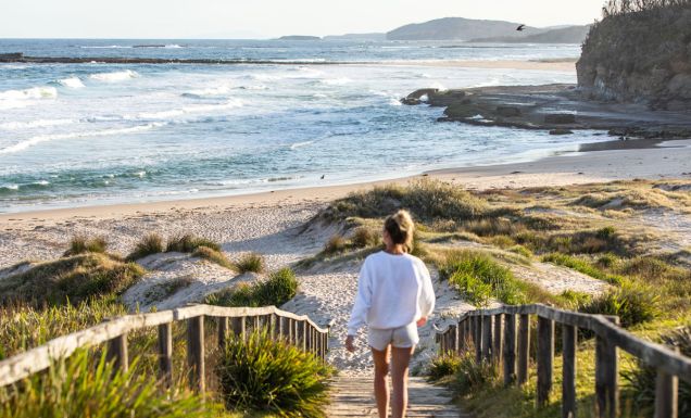 a woman walking to the shore, Pretty Beach, Shoalhaven
