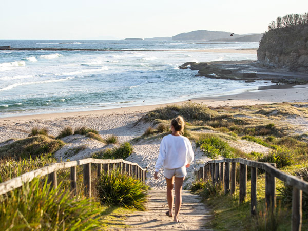 a woman heading towards the shore, Pretty Beach, Shoalhaven