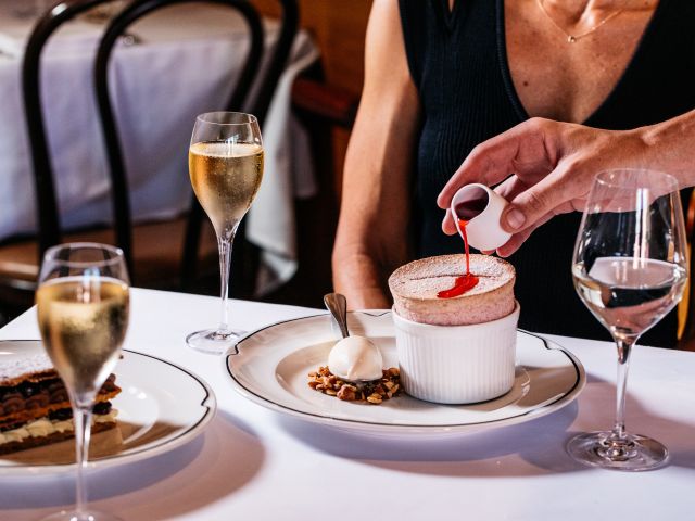 pouring syrup into soufflé at Bistro Moncur