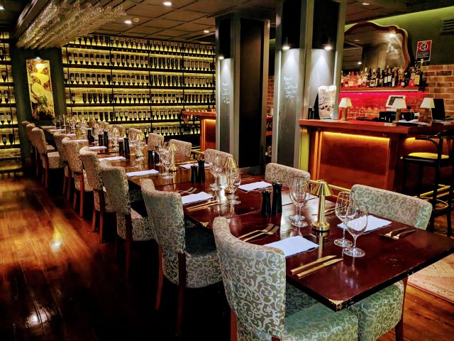 the subterranean sandstone dining room at Bon Vin 