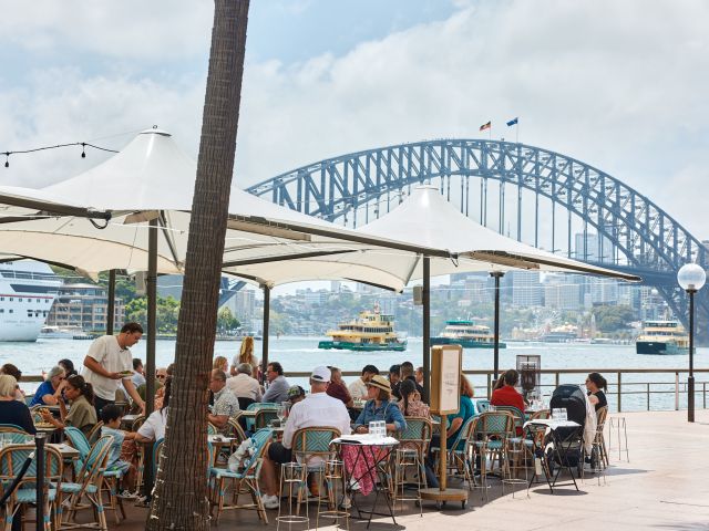 people dining alfresco at Whalebridge with Sydney harbour views