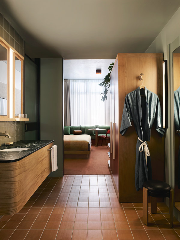 a robe hanging in the bathroom at Ace Hotel Sydney