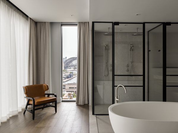a luxe suite with a tub at Capella Sydney
