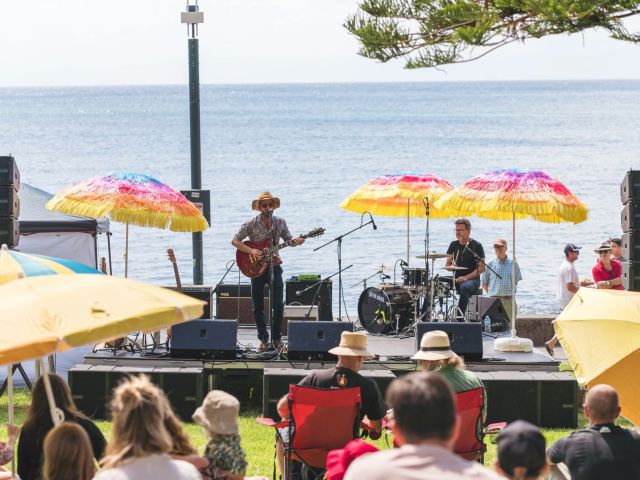 a performer singing in front of an audience during the Kiama Jazz and Blues Festival