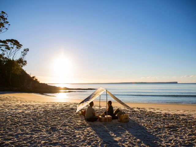 a couple having a picnic on Blenheim Beach, Jervis Bay