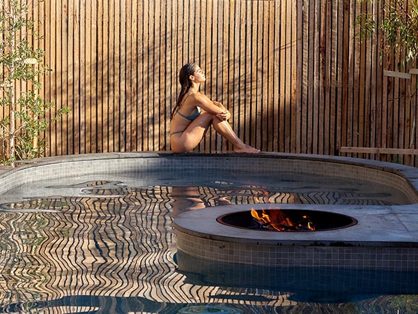 woman on edge of pool at About Time Bathhouse Torguay victoria