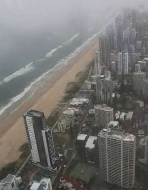 View south along the Gold Coast, from Broadbeach cityscape through window of high observation point on stormy, overcast afternoon