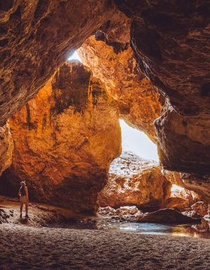 woman standing inside Dimalurru (Tunnel Creek) the kimberleys western australia
