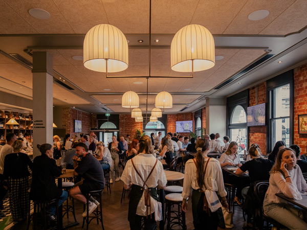 a crowd-filled pub at The Gardiner Hotel