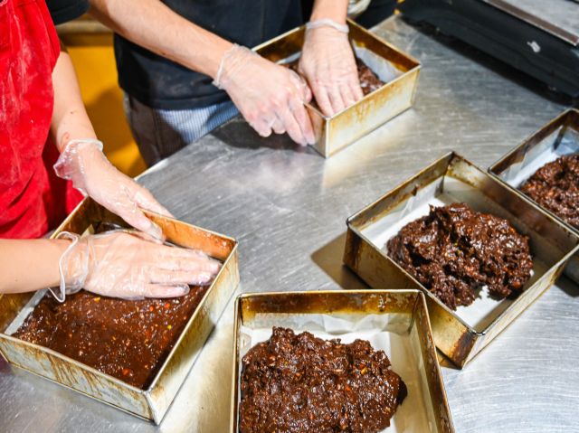 hands busy moulding dough at Brickfields Bakery