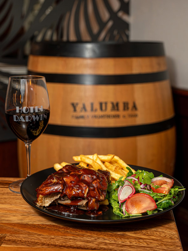 barbecued pork ribs with a glass of wine at Hotel Darwin