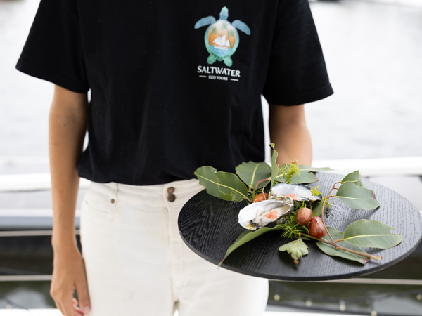 Saltwater Eco Tours team member serving at Curated Plate festival