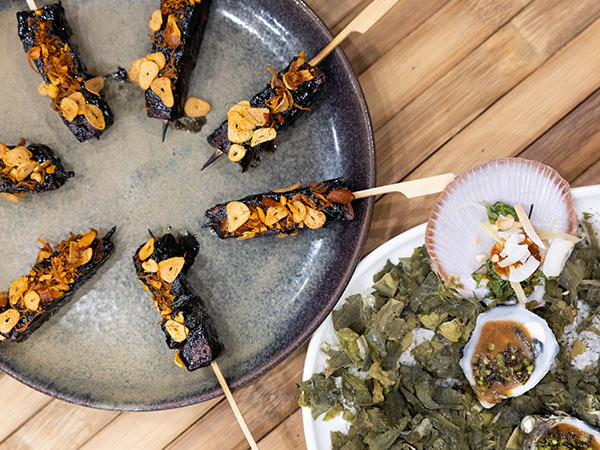 skewers and oyster dishes at Curated Plate