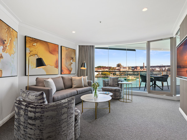 The living room interior of a Deluxe Harbour View Suite at Pullman Quay Grand Sydney Harbour.